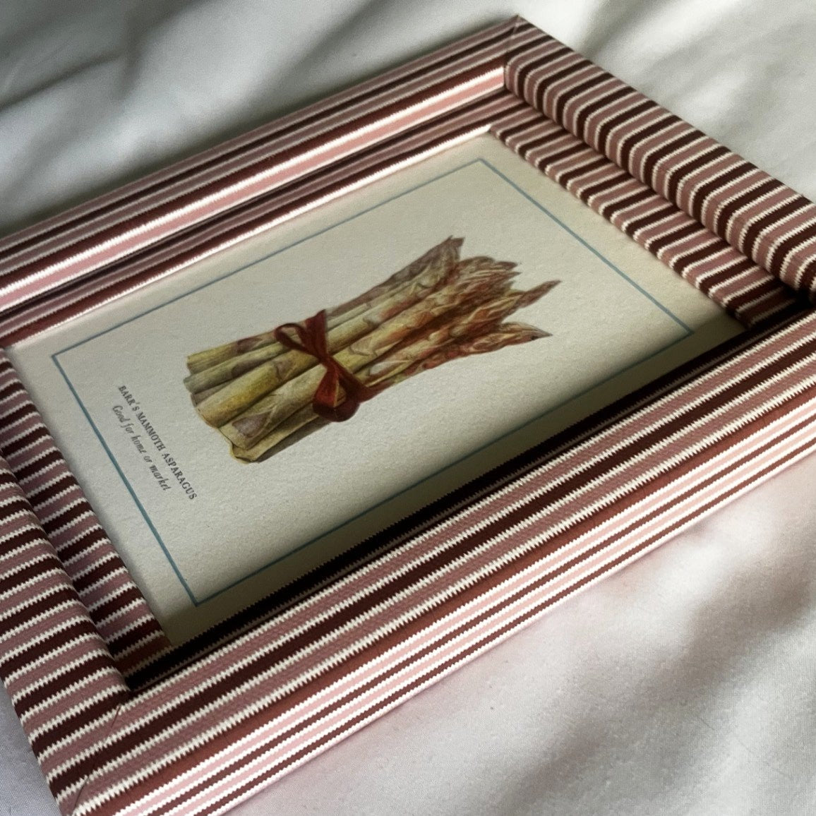 Side angle of framed Asparagus vegetable pink illustration with Blush & Burgundy red Zigzag handcrafted design.