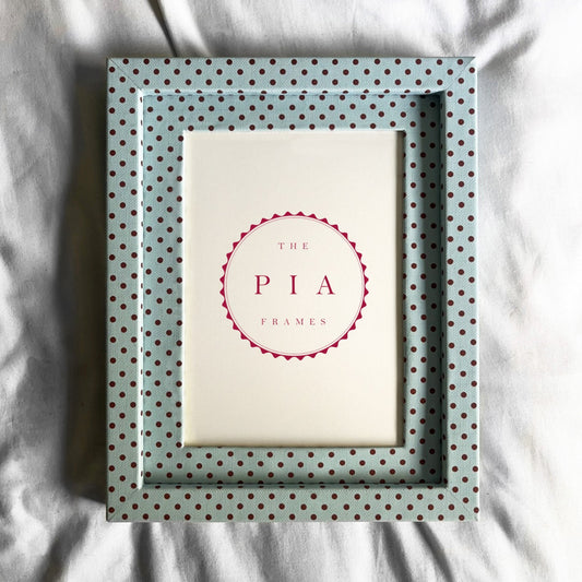 Polka dot picture frame white fabric background