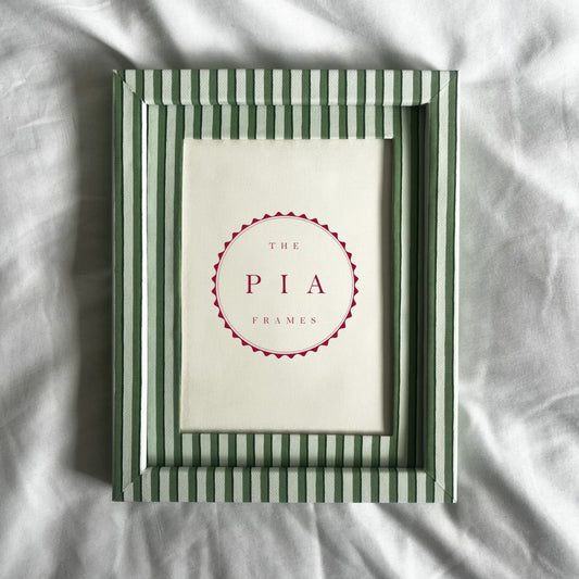 Green and white striped picture frame with 'The Pia Frames' logo on a light background