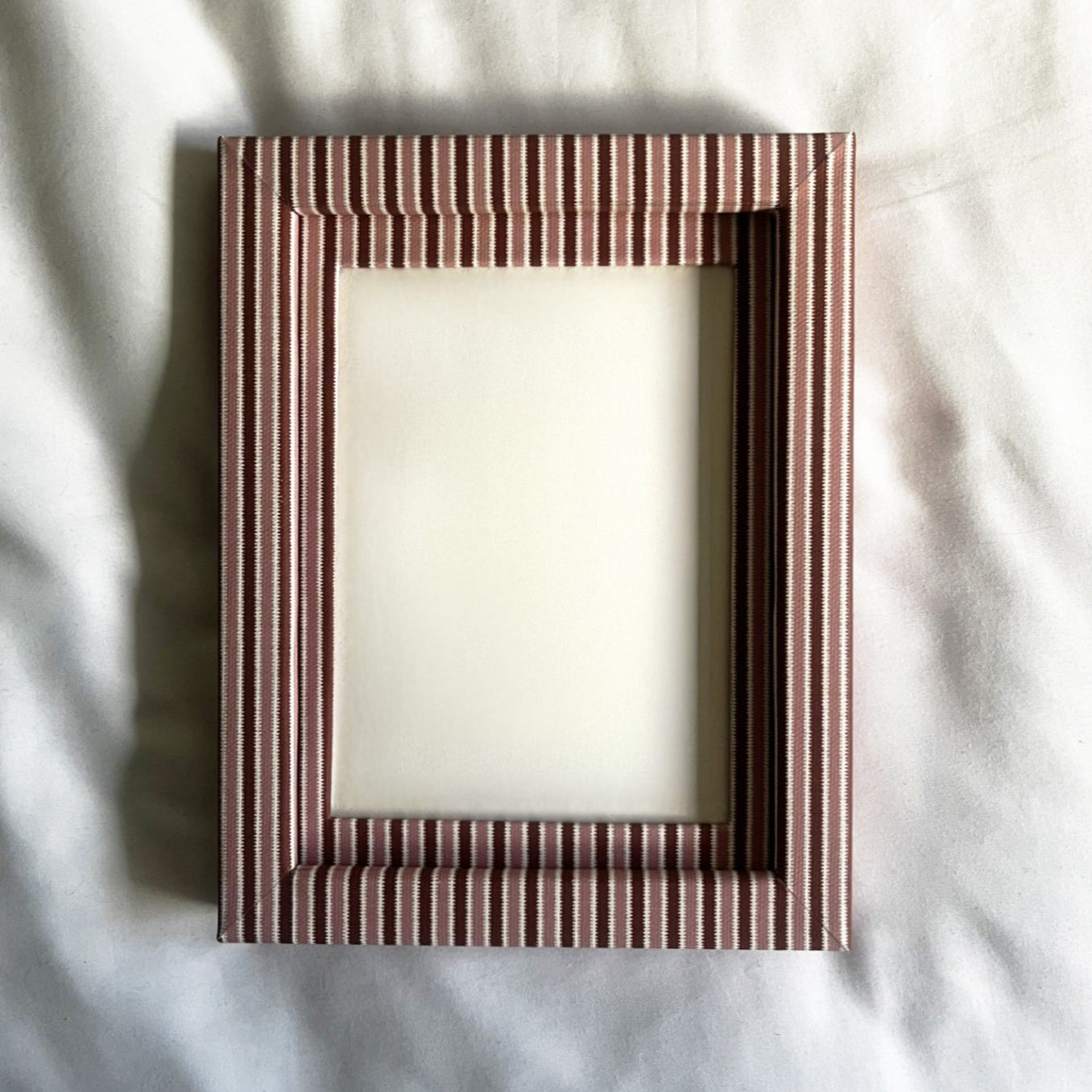 picture frame on a white fabric background