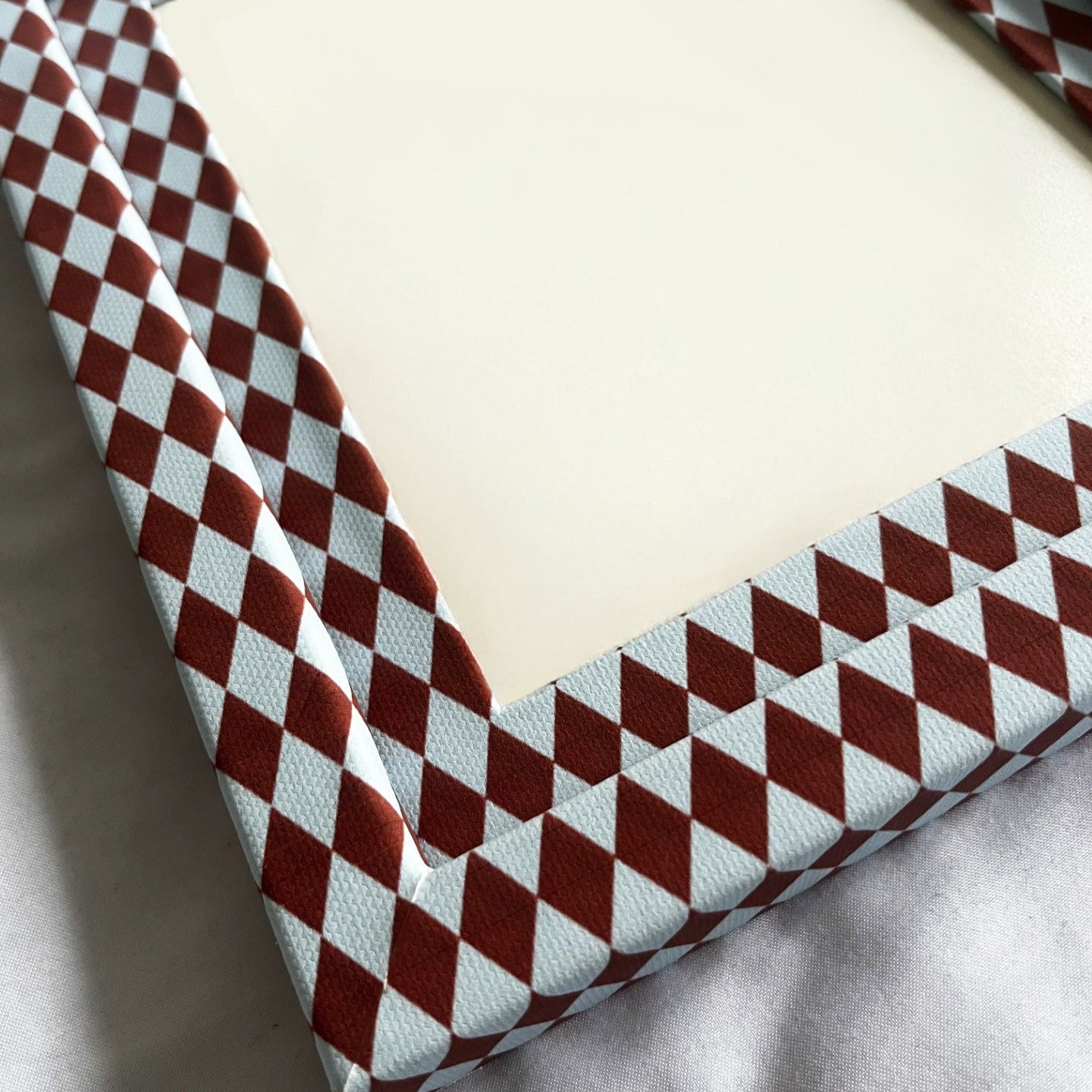 Checkered patterned fabric on a flat surface