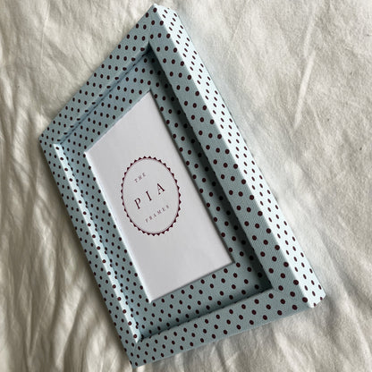 Side view of handmade blue and burgundy Pembroke polka dot fabric picture frame, showcasing its design and depth