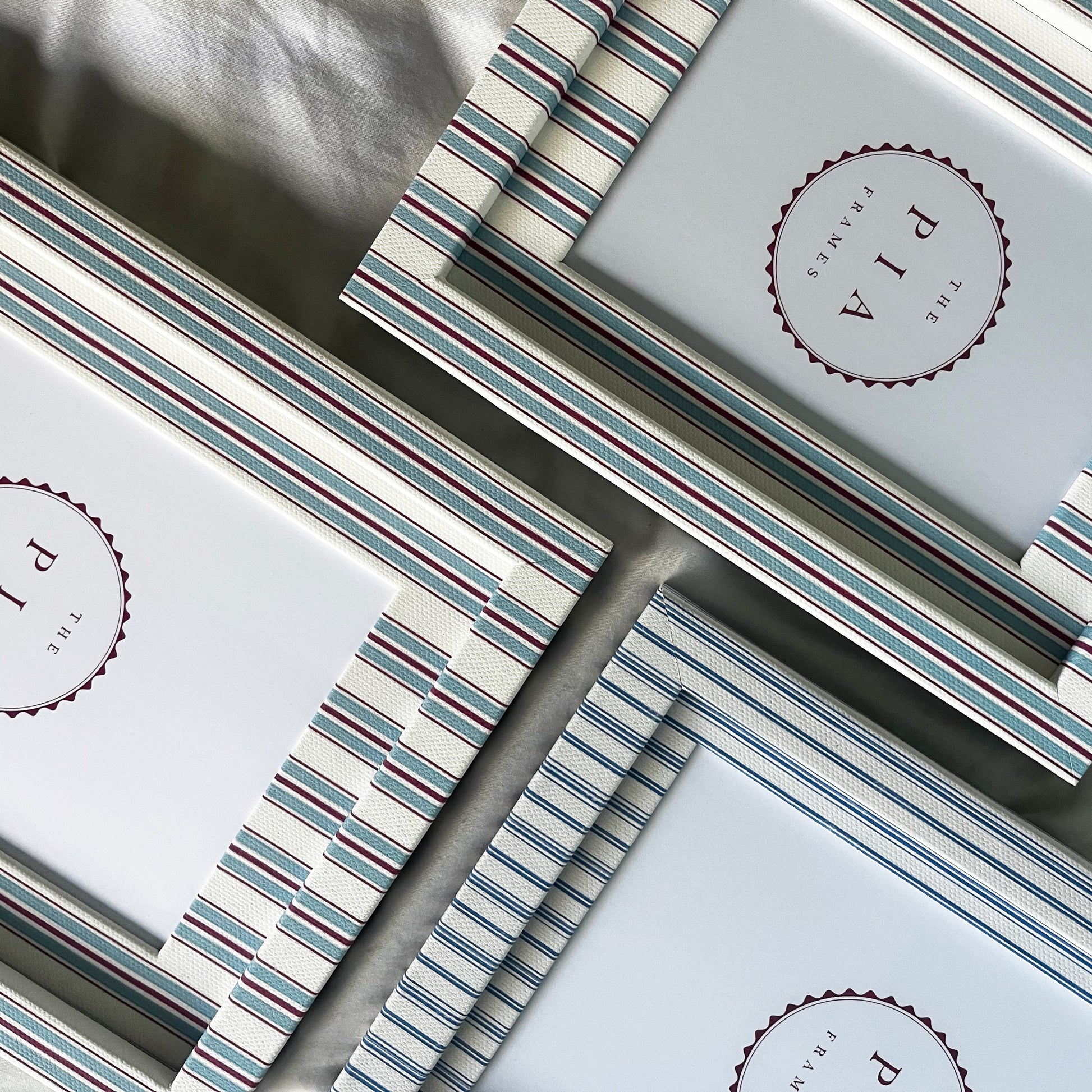 three blue striped hand made cotton picture frames 
