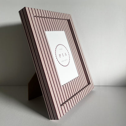 Handmade standing blush and burgundy zigzag picture frame on plain background
