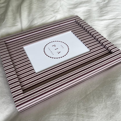 Handmade blush and burgundy zigzag picture frame angled full view on plain background