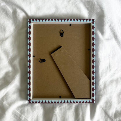 back view of a handmade geometric fabric photo frame showcasing wall fittings and frame structure