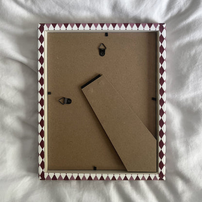 back view of a handmade geometric fabric photo frame showcasing wall fittings and frame structure