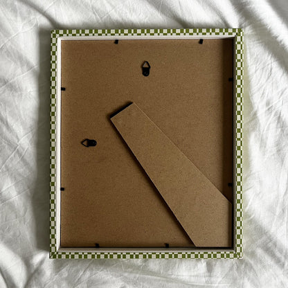 Back of handmade green checkered picture frame showing stand and fittings
