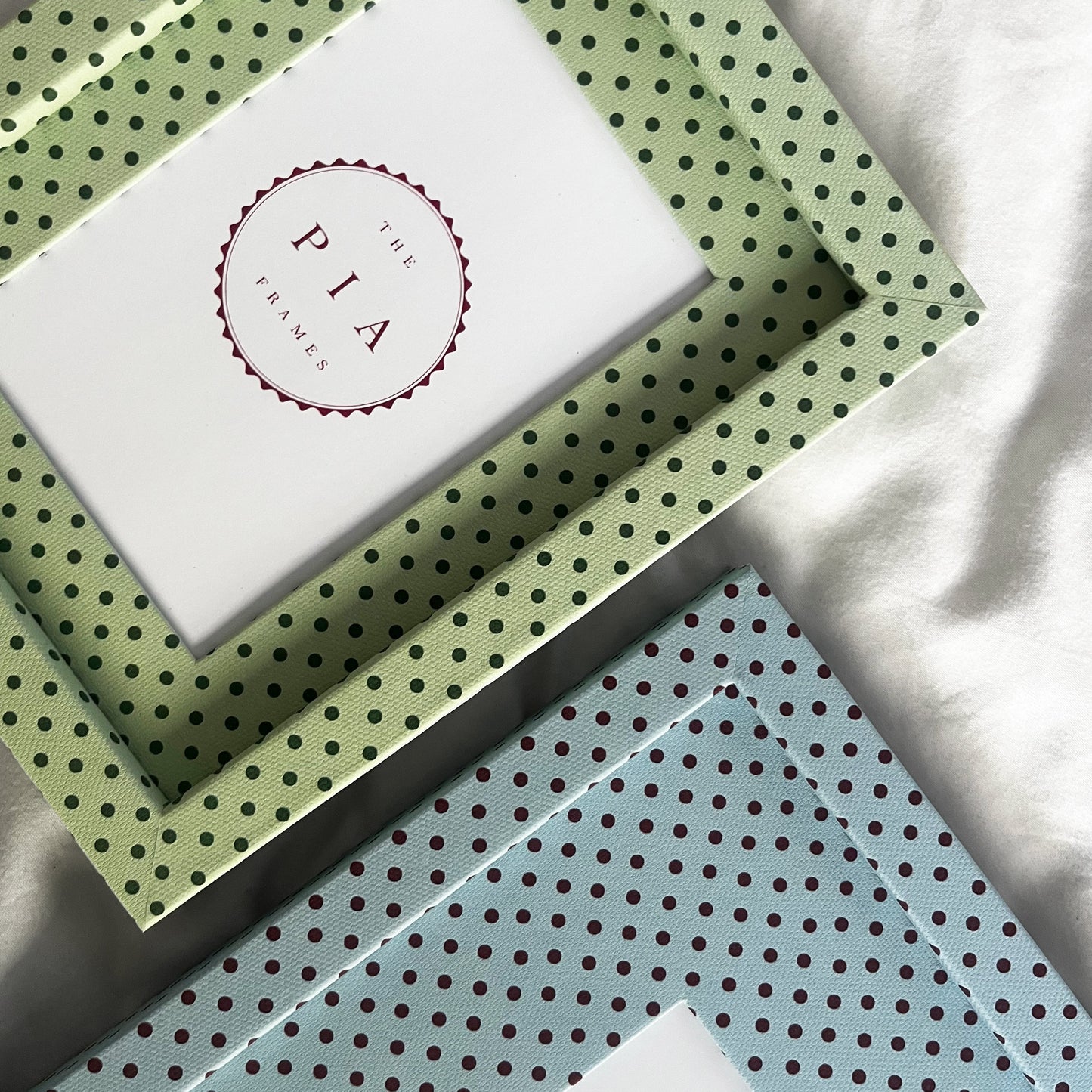 Two handmade fabric polka dot picture frames