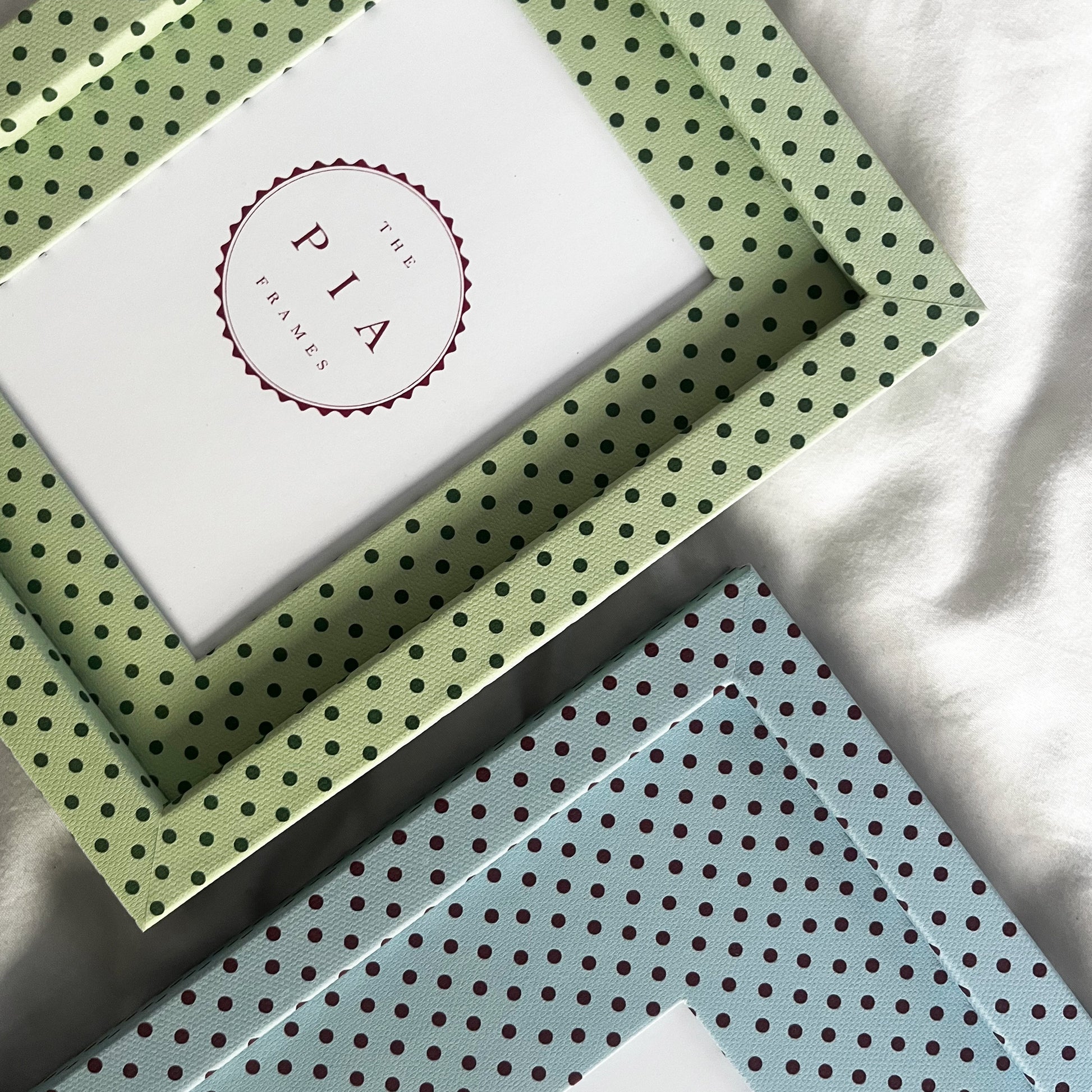 Two handmade fabric polka dot picture frames