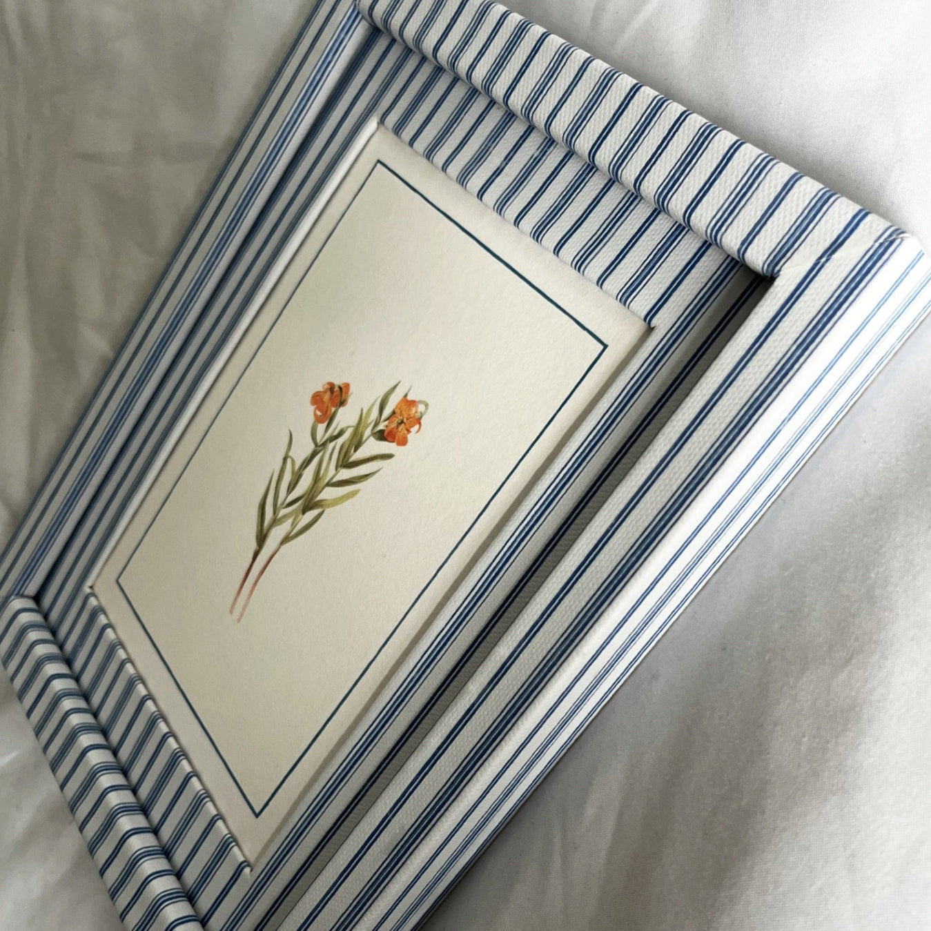 Side angle of Lilium Columbianum print highlighting the handcrafted Rustic Blue Stripe frame wrapped in 100% cotton