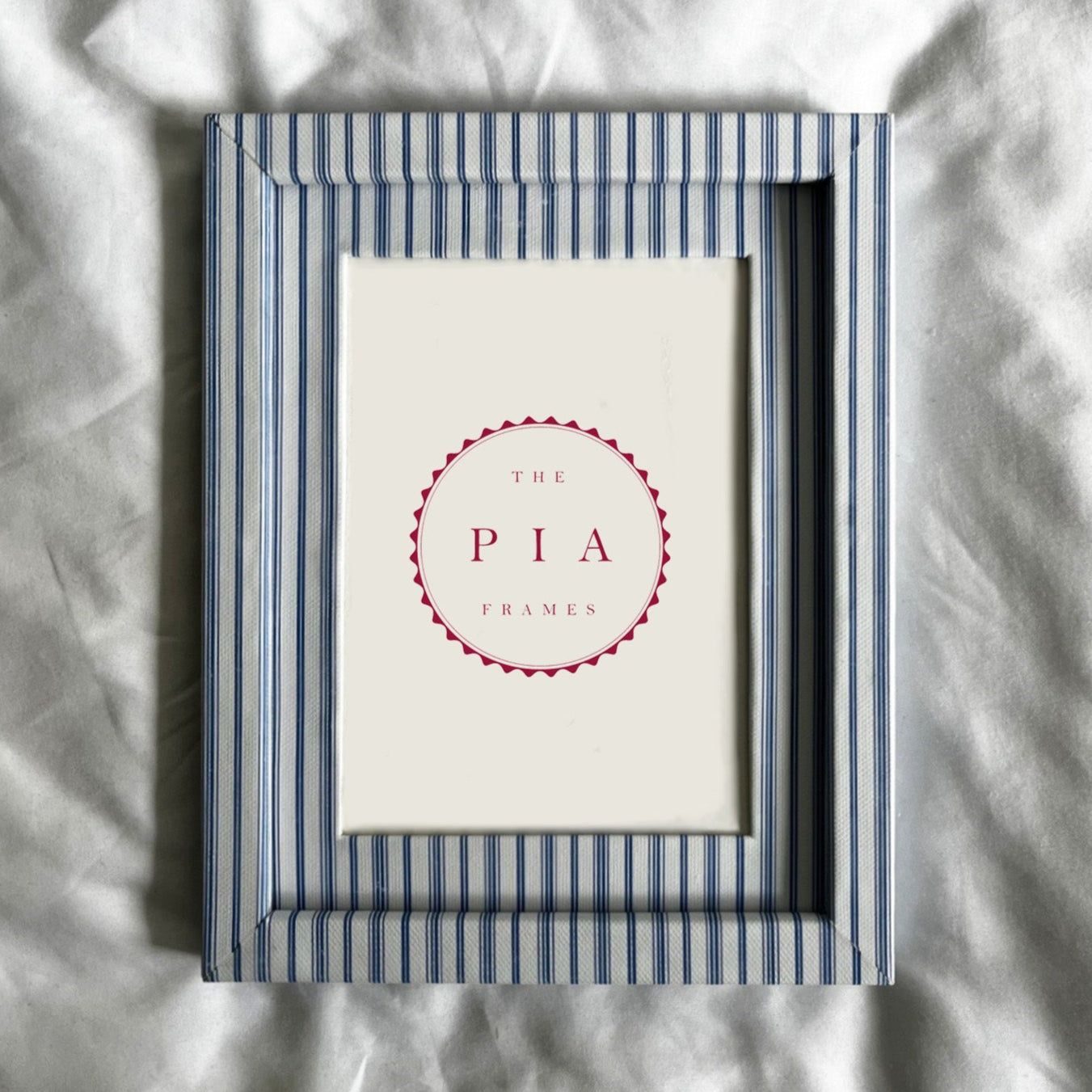 Framed picture with 'The Pia' logo on a textured white background
