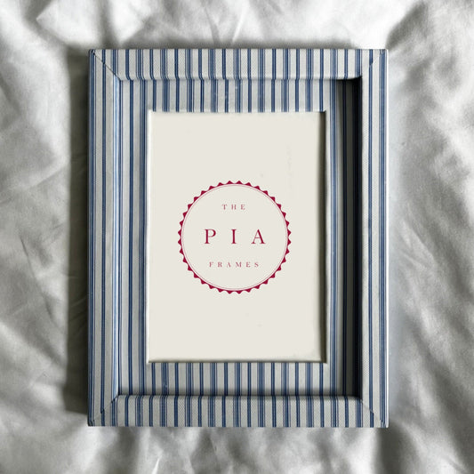Framed picture with 'The Pia' logo on a textured white background