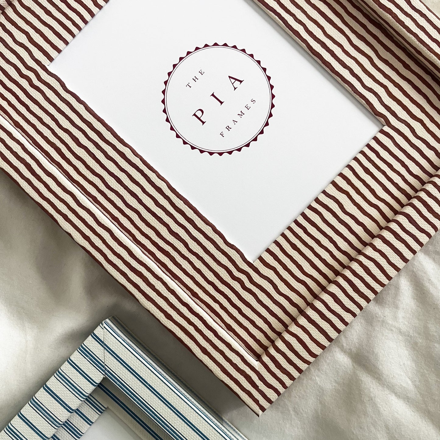 Pair of two stripe picture frames in terracotta and blue